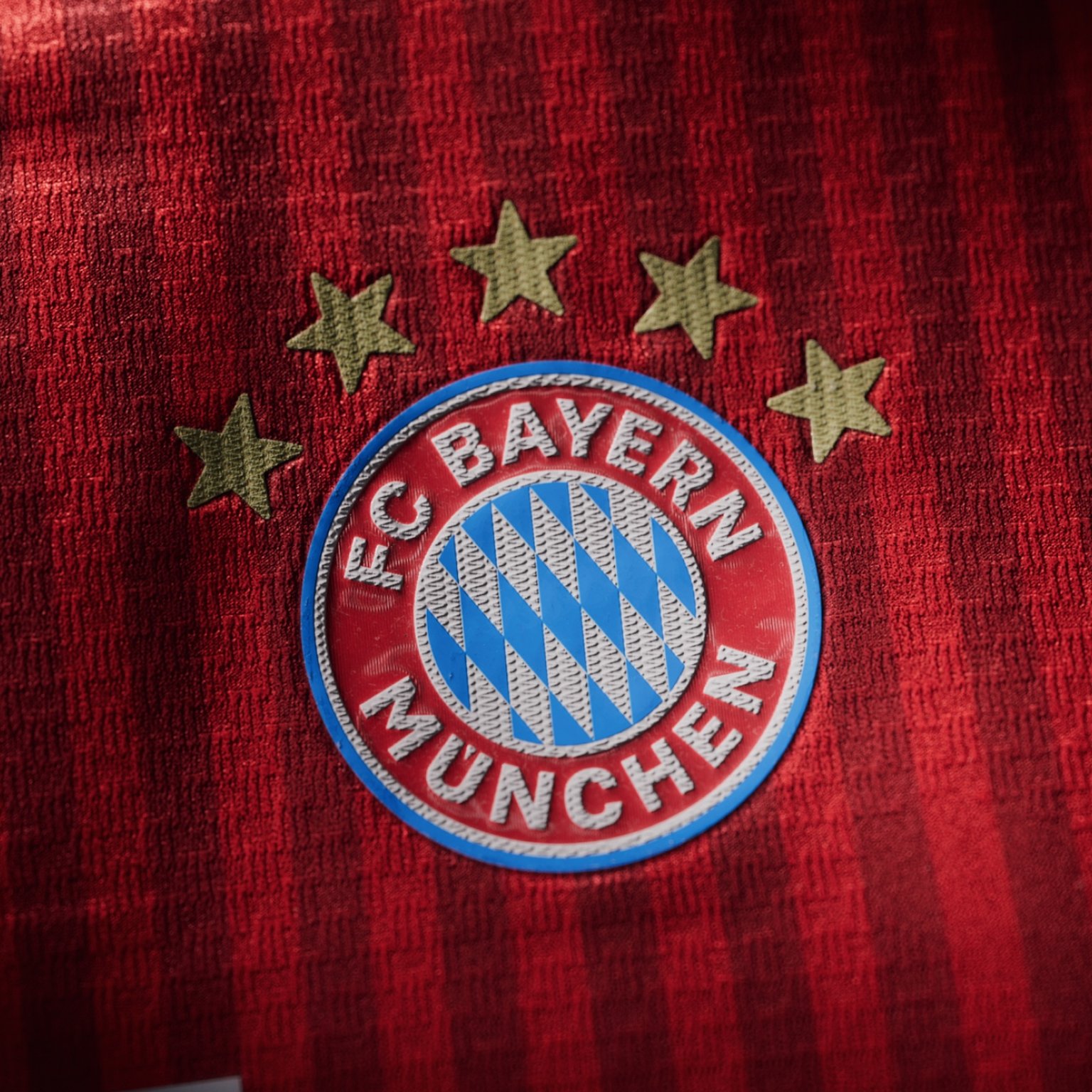 Visual featuring the new FC Bayern 26/27 Home Kit Crest